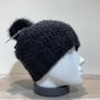 Bonnet tricot uni noir fil en lurex brillant doublé avec pompon Herman